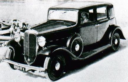 Detail view of the instrument cluster, steering wheel, and Plymouth front.