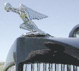 22k photo of 1937 Packard 120C 4-door touring sedan, mascot